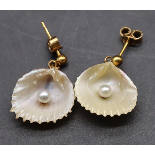 435 - A pair of gold and Mother of Pearl drop earrings in the form of shells mounted with pearls, cased