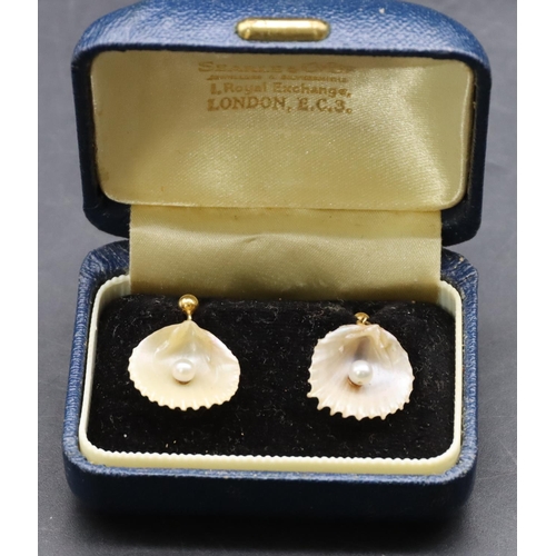 435 - A pair of gold and Mother of Pearl drop earrings in the form of shells mounted with pearls, cased