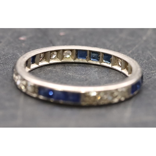 438 - A platinum/white gold sapphire and diamond full eternity ring, size M/N, 2.2 grams gross