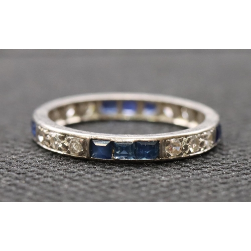 438 - A platinum/white gold sapphire and diamond full eternity ring, size M/N, 2.2 grams gross