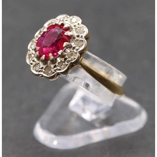 441 - An 18ct gold ladies' oval cluster ring set with centre ruby surrounded by diamonds, size K, 3.3 gram... 