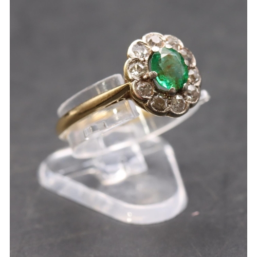 442 - A ladies' gold  oval cluster ring set with centre emerald surrounded by small diamonds, size P, 2.8 ... 