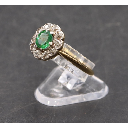 442 - A ladies' gold  oval cluster ring set with centre emerald surrounded by small diamonds, size P, 2.8 ... 