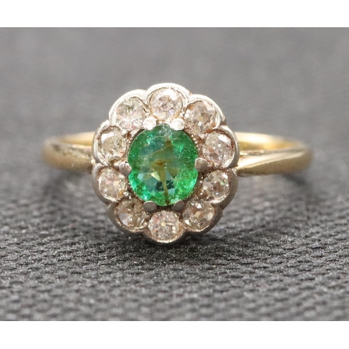 442 - A ladies' gold  oval cluster ring set with centre emerald surrounded by small diamonds, size P, 2.8 ... 