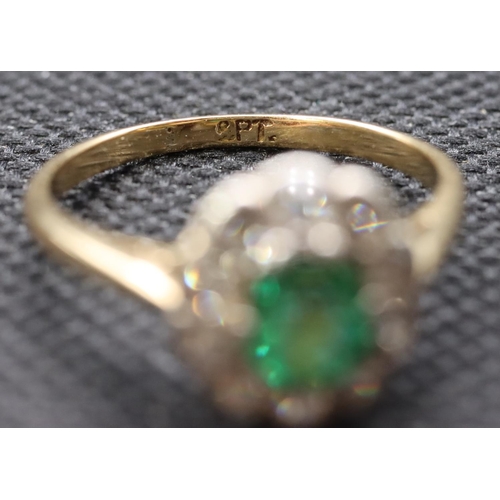 442 - A ladies' gold  oval cluster ring set with centre emerald surrounded by small diamonds, size P, 2.8 ... 