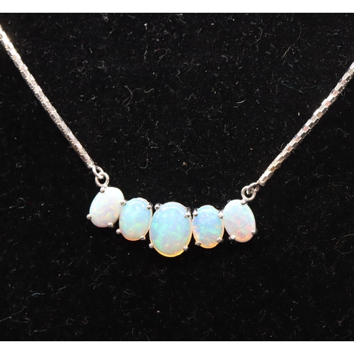 445 - A 9ct white gold drop necklace mounted with 5 opals, 53cm long, 8.6 grams gross