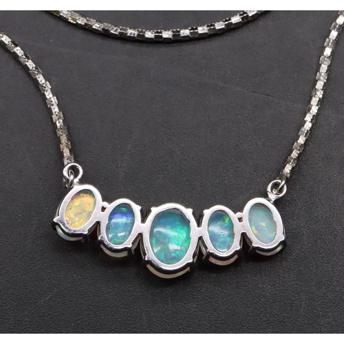 445 - A 9ct white gold drop necklace mounted with 5 opals, 53cm long, 8.6 grams gross