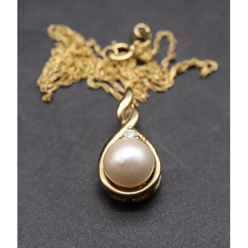 448 - A 9ct gold pendant set with pearl and single diamond, with chain, 2.2 grams gross