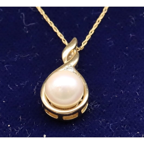 448 - A 9ct gold pendant set with pearl and single diamond, with chain, 2.2 grams gross