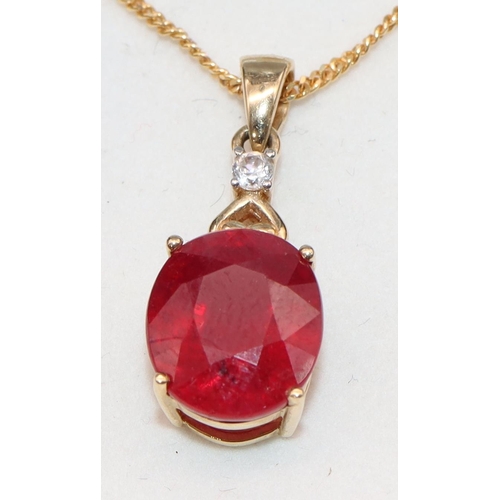 452 - A 10ct gold pendant set with ruby mounted with small diamond, with chain, overall weight 5.2 grams g... 