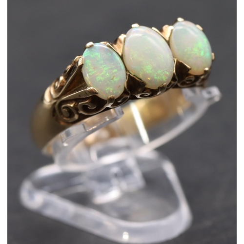 453 - A 9ct gold ladies' 3-stone opal ring, size R/S, 4.3 grams gross