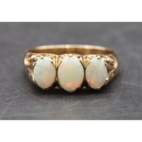 453 - A 9ct gold ladies' 3-stone opal ring, size R/S, 4.3 grams gross