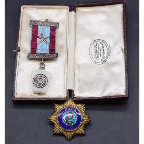 454 - A London silver gilt and enamelled RAOB medal and a part silver mounted Masonic medal (Cased) (2)