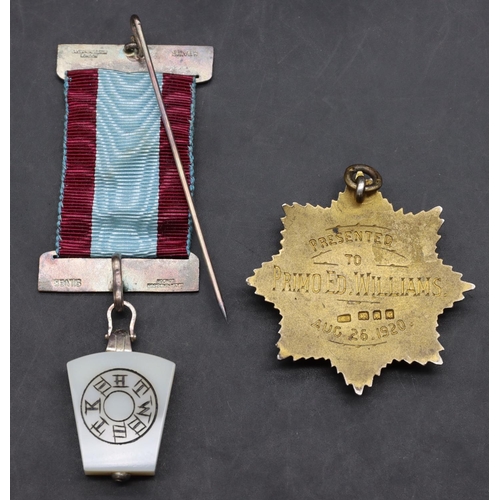 454 - A London silver gilt and enamelled RAOB medal and a part silver mounted Masonic medal (Cased) (2)