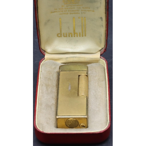 455 - A gold plated Dunhill lighter with allover engine turned decoration (Worn) (Cased)