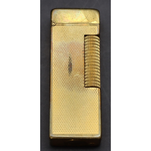 455 - A gold plated Dunhill lighter with allover engine turned decoration (Worn) (Cased)