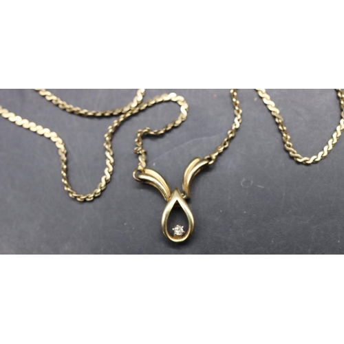 492 - A 9ct gold drop pendant set with small single diamond and with fixed chain, 45.5cm long, 5.1 grams g... 