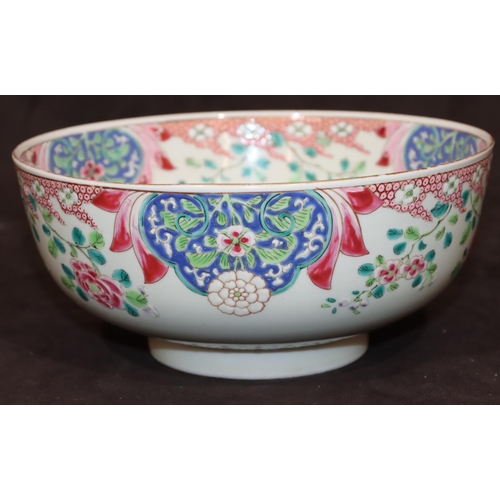 5 - An Oriental round bowl on white ground with blue and green floral, leaf and scroll decoration, 21cm ... 