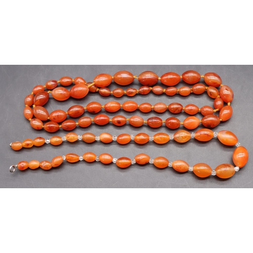 502 - An orange hardstone bead necklace and another similar small graduated necklace (2)