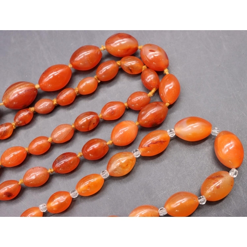 502 - An orange hardstone bead necklace and another similar small graduated necklace (2)