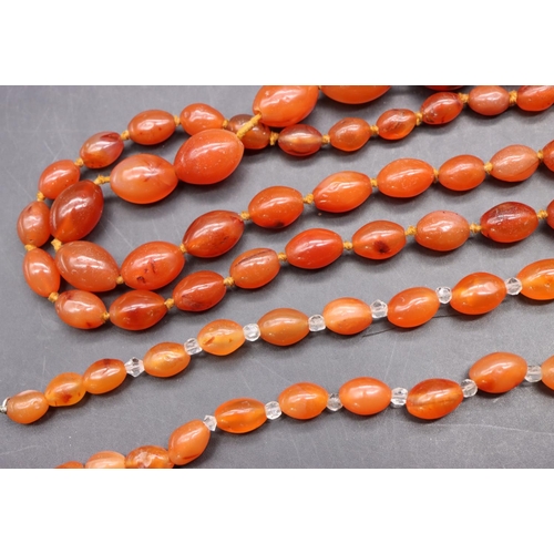 502 - An orange hardstone bead necklace and another similar small graduated necklace (2)