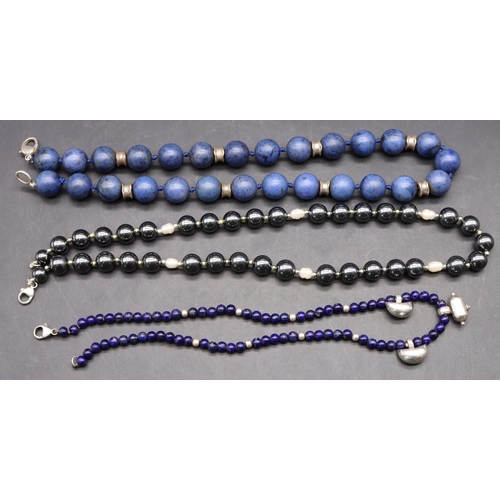 503 - A blue bead and silver necklace, a metal bead and silver necklace and a small lapis lazuli and silve... 