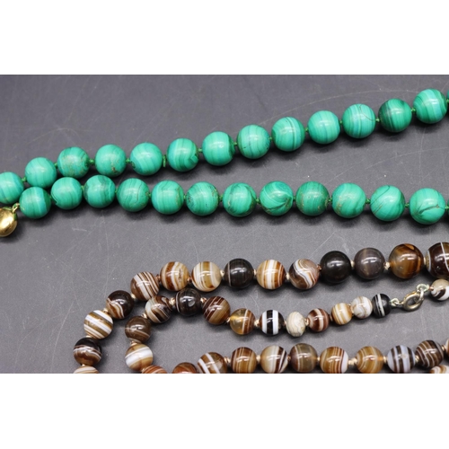 504 - An unusual green hardstone bead necklace, a malachite graduated bead necklace with 9ct gold clasp an... 