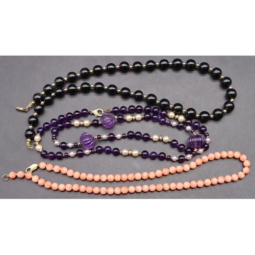 505 - An amethyst style pearl and gold bead necklace with 9ct gold clasp, a coral bead necklace with 9ct g... 