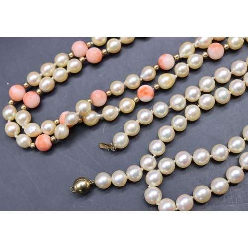 506 - A cultured pearl and 9ct gold clasp necklace, 46.5cm long and a cultured pearl and coral bead neckla... 