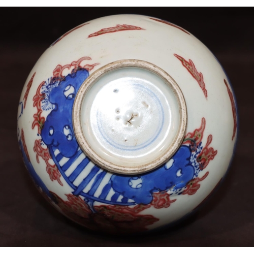 51 - An Oriental round gourd shaped vase on white, red and blue ground with figure decoration, 22.5cm hig... 