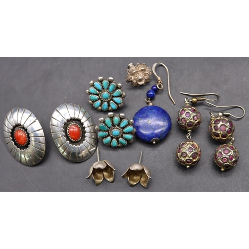 514 - A pair of oval silver earrings set with centre red stones, a pair of silver and turquoise earrings, ... 