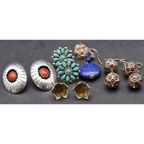 514 - A pair of oval silver earrings set with centre red stones, a pair of silver and turquoise earrings, ... 