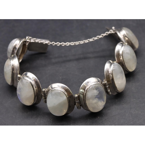 518 - A silver bracelet set with 8 milky Labradorite style stones