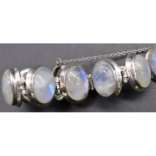 518 - A silver bracelet set with 8 milky Labradorite style stones