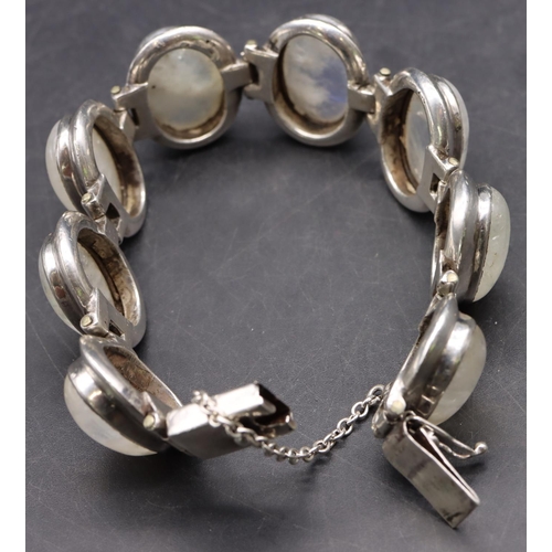 518 - A silver bracelet set with 8 milky Labradorite style stones