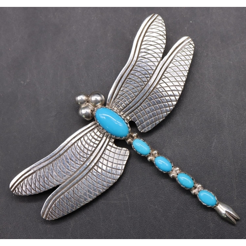 527 - Joe Delgarito, sterling silver brooch in the form of a dragonfly with turquoise bead body, wingspan ... 