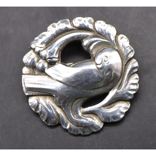 528 - Georg Jensen, 925 silver brooch, numbered 134, in the form of a bird, 3cm diameter, 11.7 grams