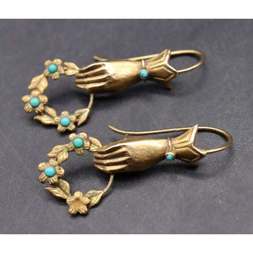 533 - A pair of 9ct gold novelty drop earrings in the form of hands holding garland mounted with turquoise... 