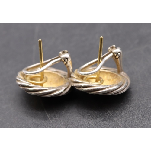 543 - A pair of 18ct gold and silver mounted circular earrings, 11.2 grams gross