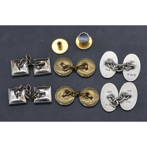 557 - A pair of silver gentleman's oval cufflinks, 2 other pairs of cufflinks and single dress stud (7)