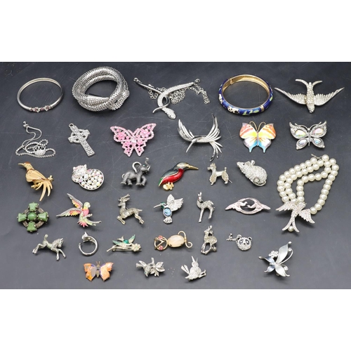 575 - A silver bangle and a quantity of various silver animals, bangles etc.