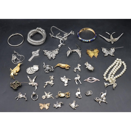 575 - A silver bangle and a quantity of various silver animals, bangles etc.