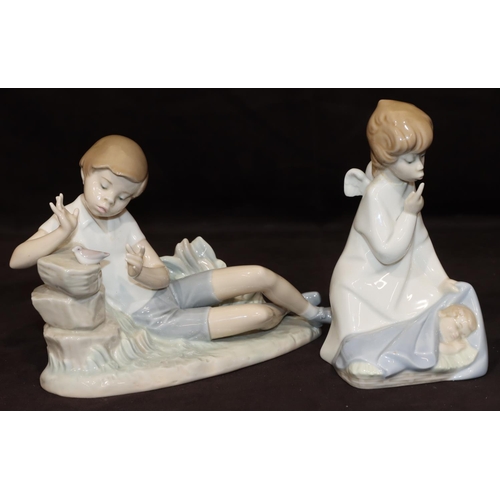 58 - A Lladro figure of a resting boy with bird, 23cm long, a Lladro figure of an angel kneeling over chi... 