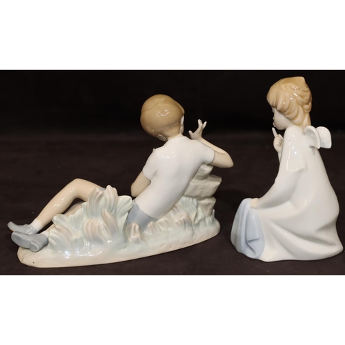 58 - A Lladro figure of a resting boy with bird, 23cm long, a Lladro figure of an angel kneeling over chi... 