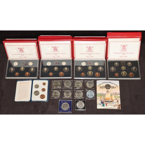 582 - A set of 4 Royal Mint United Kingdom coin collection sets in red cases, 2 x 1985, 2 x 1986 and an Am... 