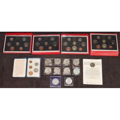 582 - A set of 4 Royal Mint United Kingdom coin collection sets in red cases, 2 x 1985, 2 x 1986 and an Am... 