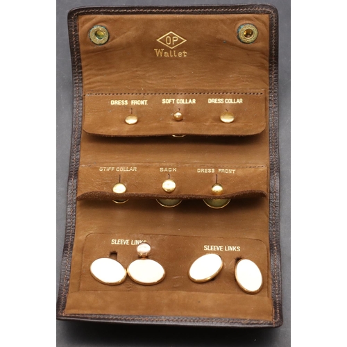 586 - A pair of 15ct gold gentleman's plain oval cufflinks, 5.7 grams and 7 various 9ct gold dress studs, ... 