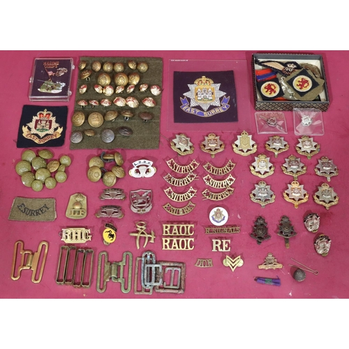 641 - A small quantity of various military cap badges, buttons, etc.