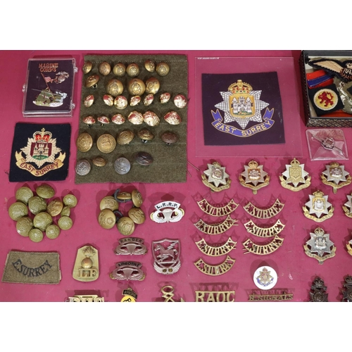 641 - A small quantity of various military cap badges, buttons, etc.