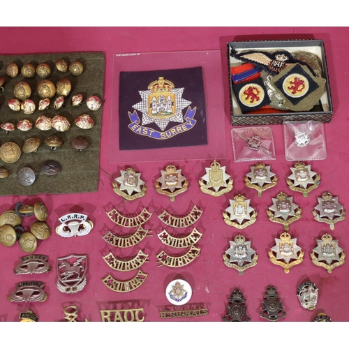 641 - A small quantity of various military cap badges, buttons, etc.